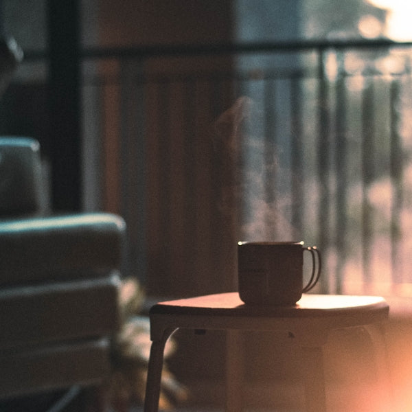 a coffee cup sitting on top of a table
