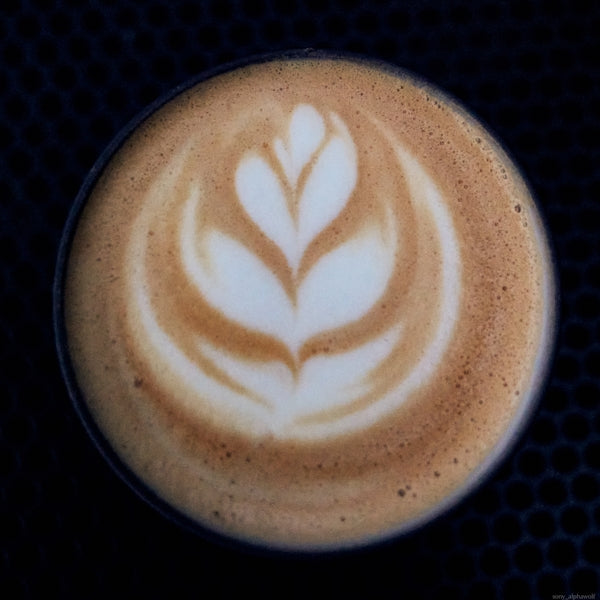 a coffee cup with a design on it