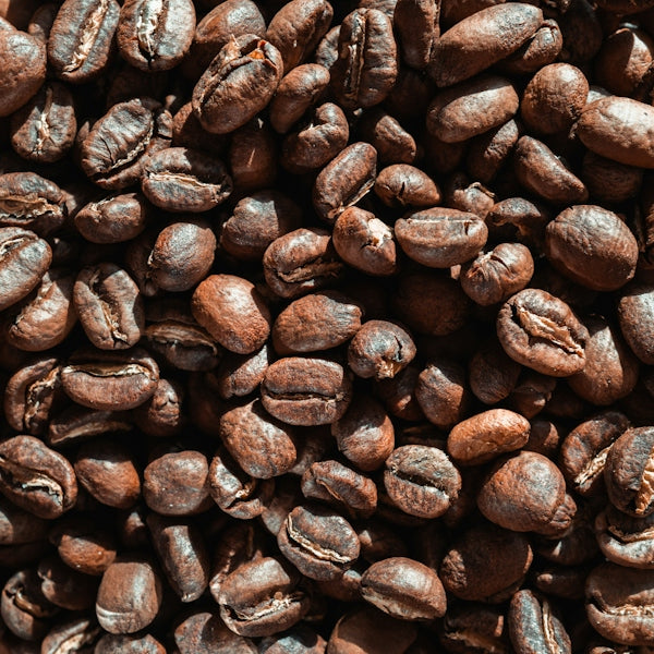 A pile of coffee beans sitting on top of each other