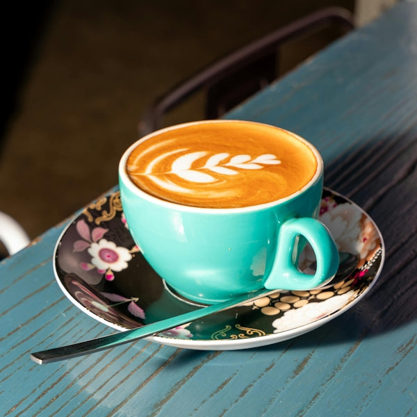 A cup of coffee sitting on top of a saucer