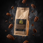 Brown coffee bag with pecans and smoke effect on a dark background