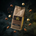 Brown coffee bag with a label on a dark background with floating coffee beans and hazelnuts.